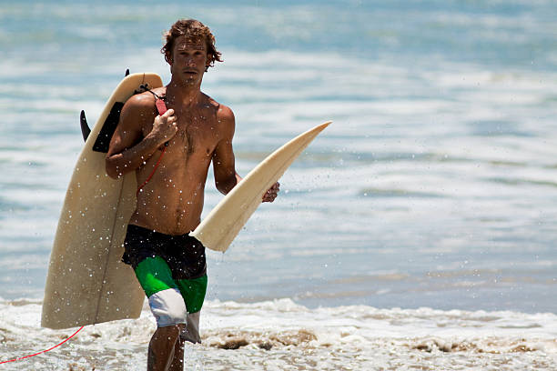 surfer with a broken board
