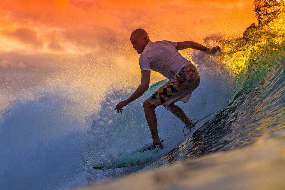 Surfing at sunset in Bali