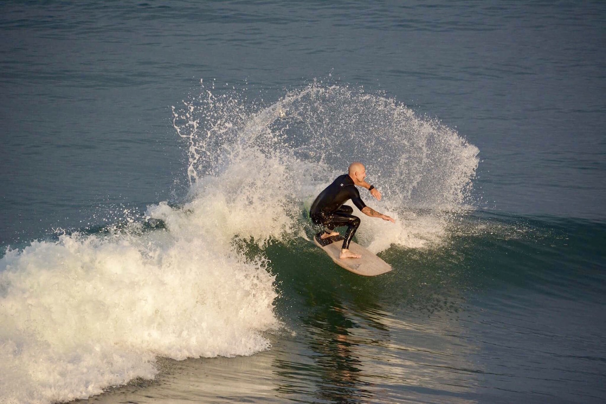 surfing on tomo evo surfboard