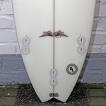 Which material were used by Stacey for creating Surfboards Wolf