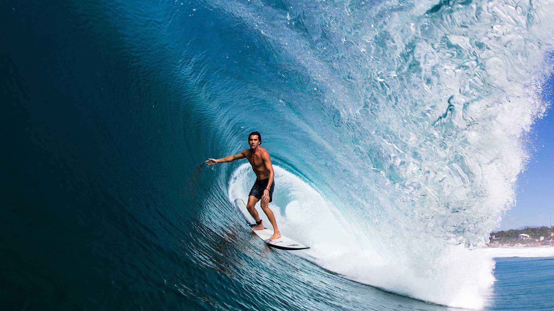Greg Long surfs
