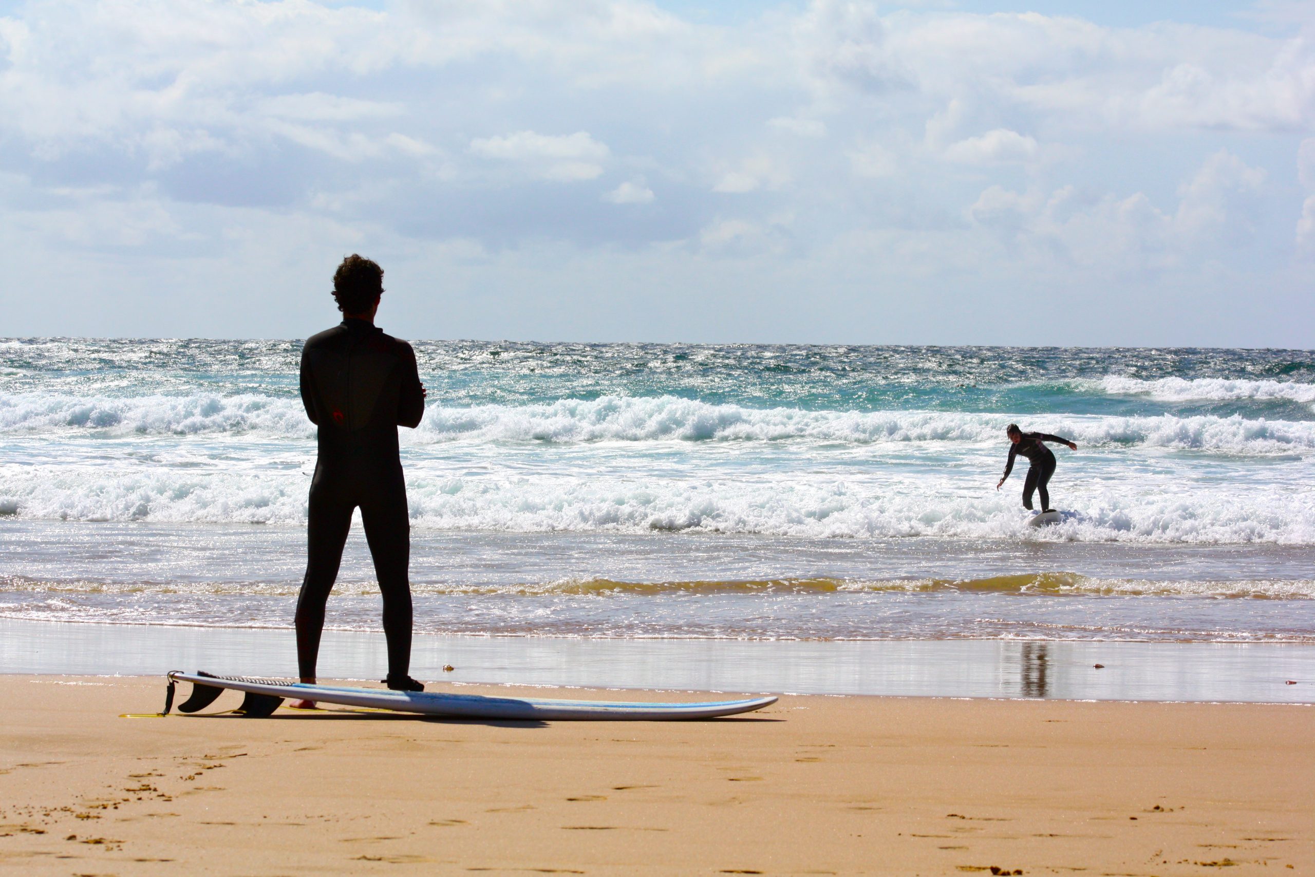 surfers on beach